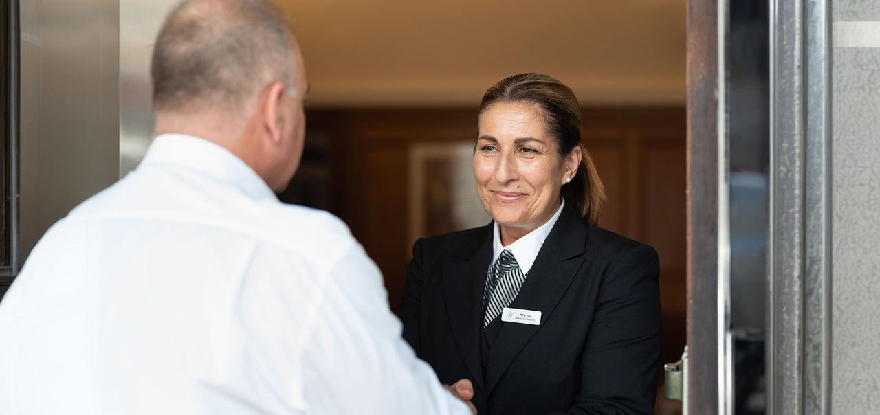 funeral director welcoming man
