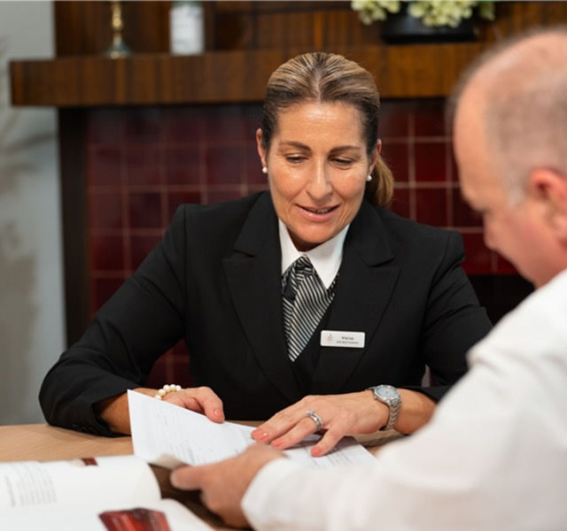 WN bull funeral director helping a client