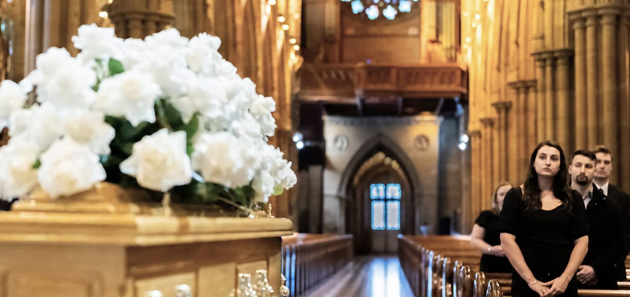 flowers on top of a coffin