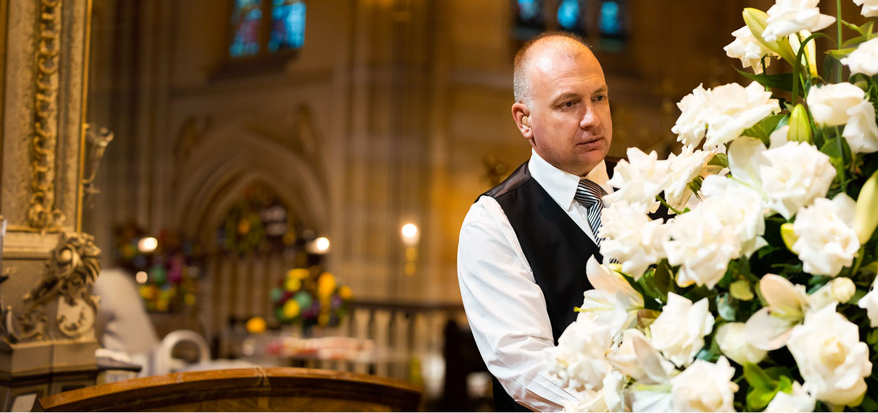 WN Bull funeral director arranging flowers